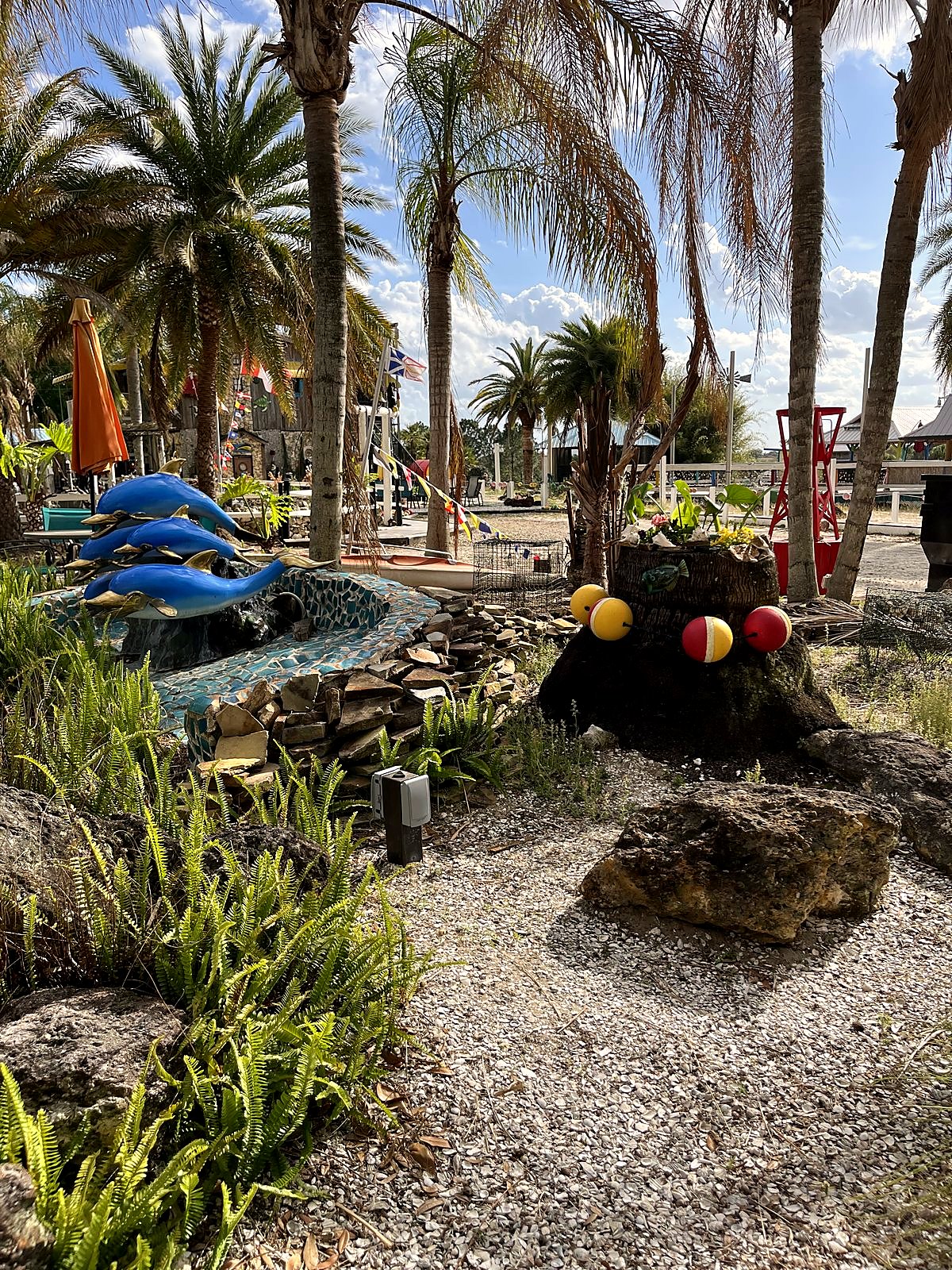 Compound area with dolphin sculptures
